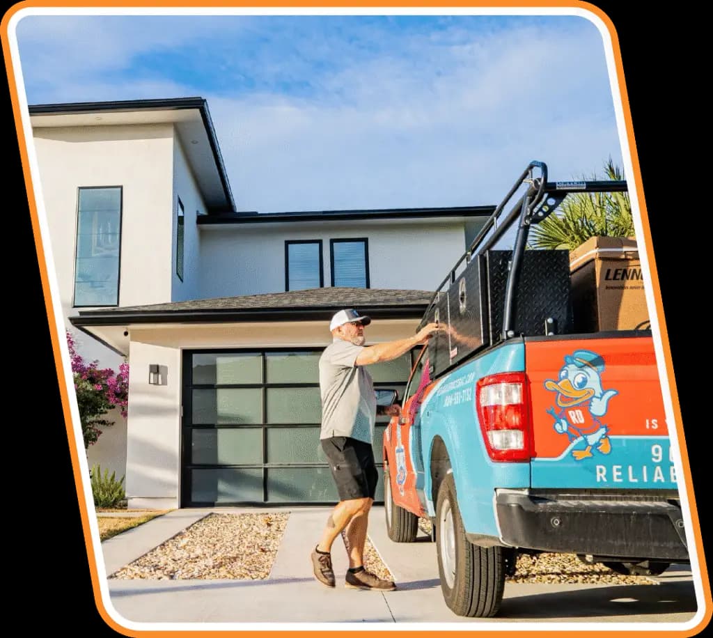 Reliable Ducts HVAC technician unloading service truck at a Jacksonville home