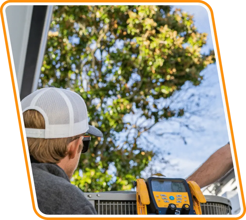 Technician performing AC maintenance and diagnostic testing on outdoor unit in San Marco, FL.